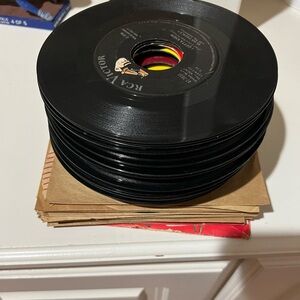 Stack of 50 vinyl records.